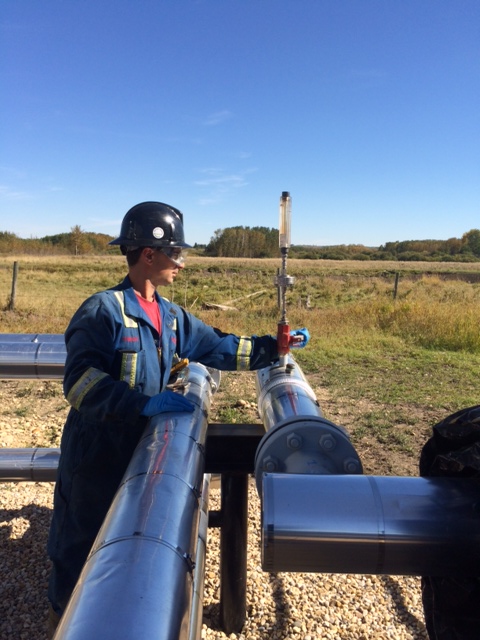 A Contact field representative conducting on-site well tests